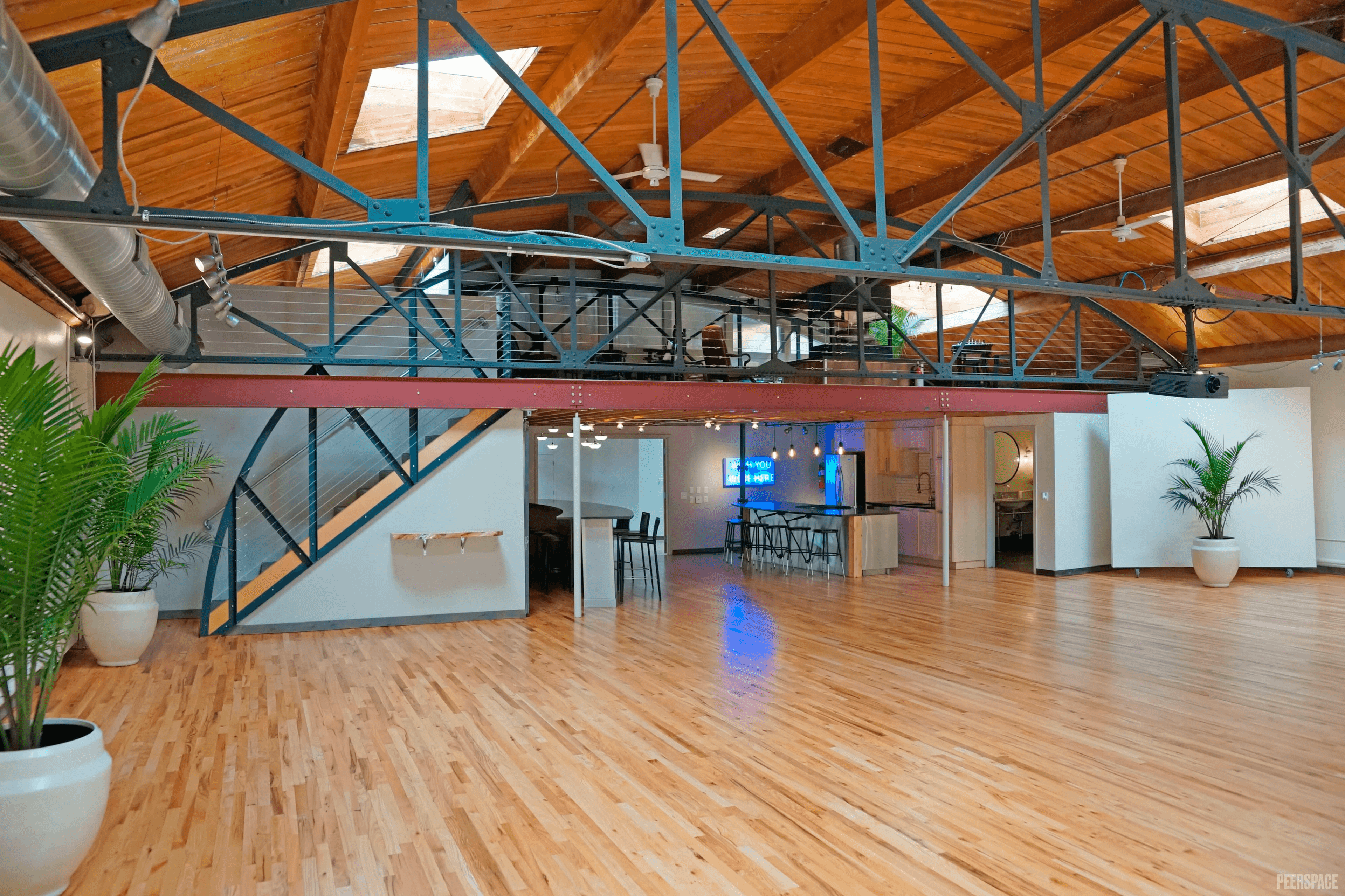 Sterling Event Space daylight conditions — skylights, hardwood floor, steel trusses
