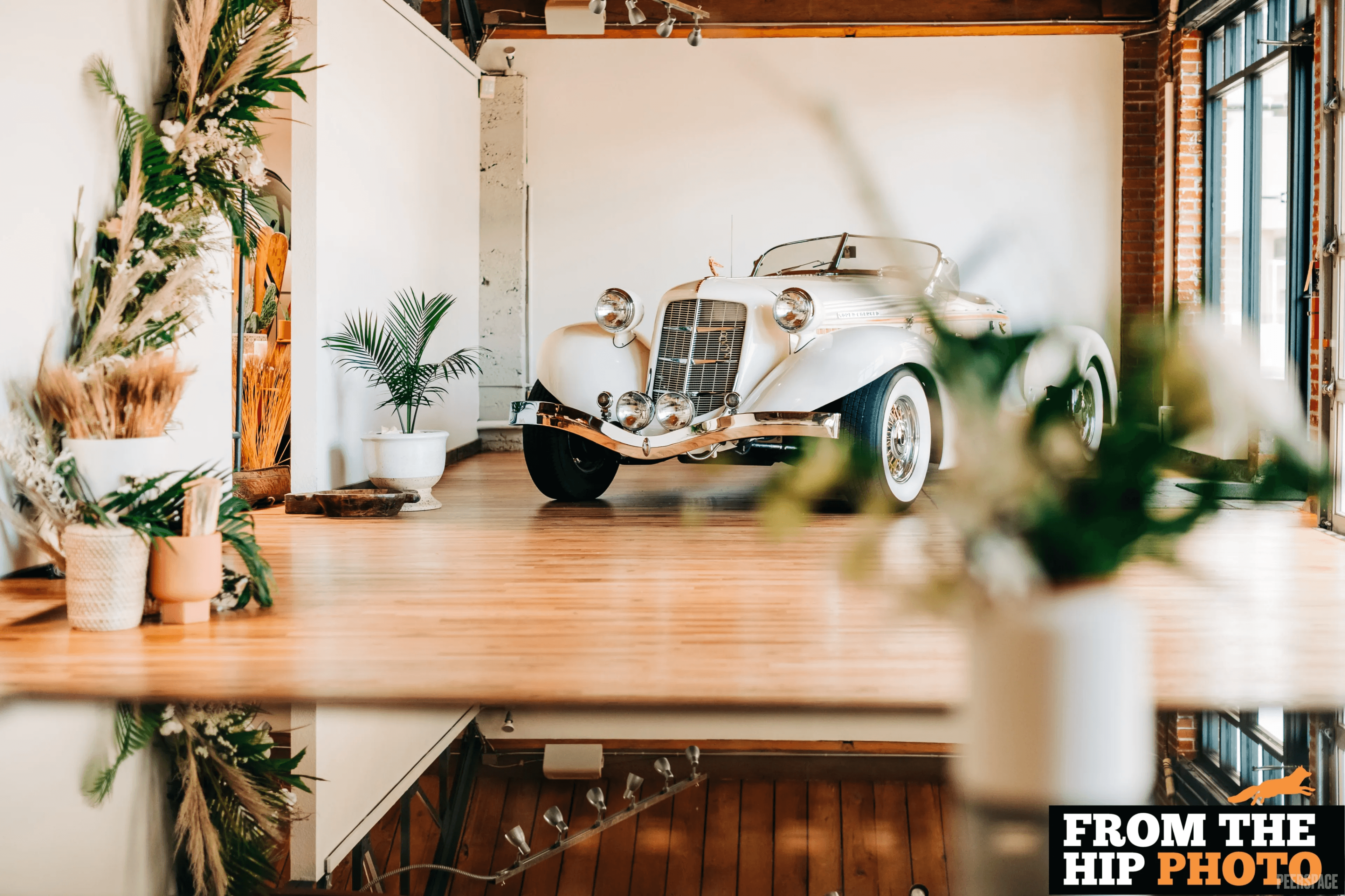 Vintage convertible parked inside Sterling Event Space for a Denver film and photo production shoot
