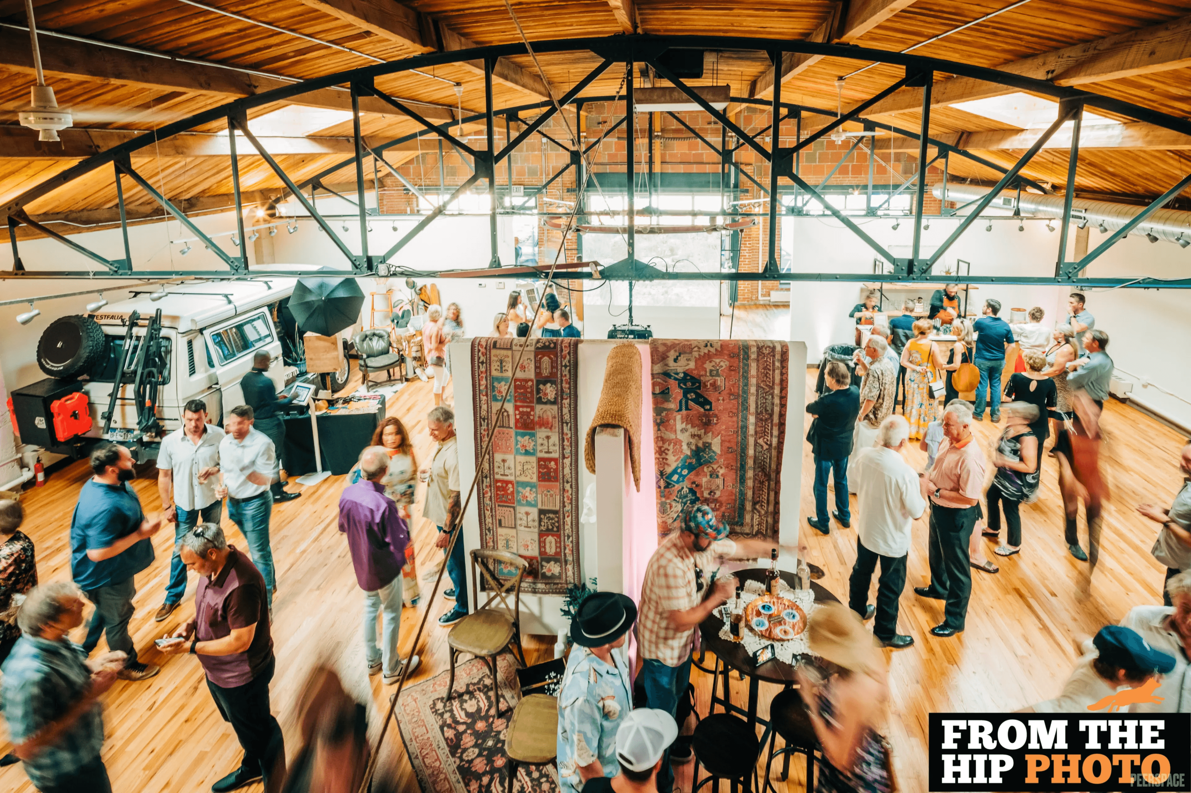 Indoor pop-up market at Sterling Event Space, vendor displays under skylights