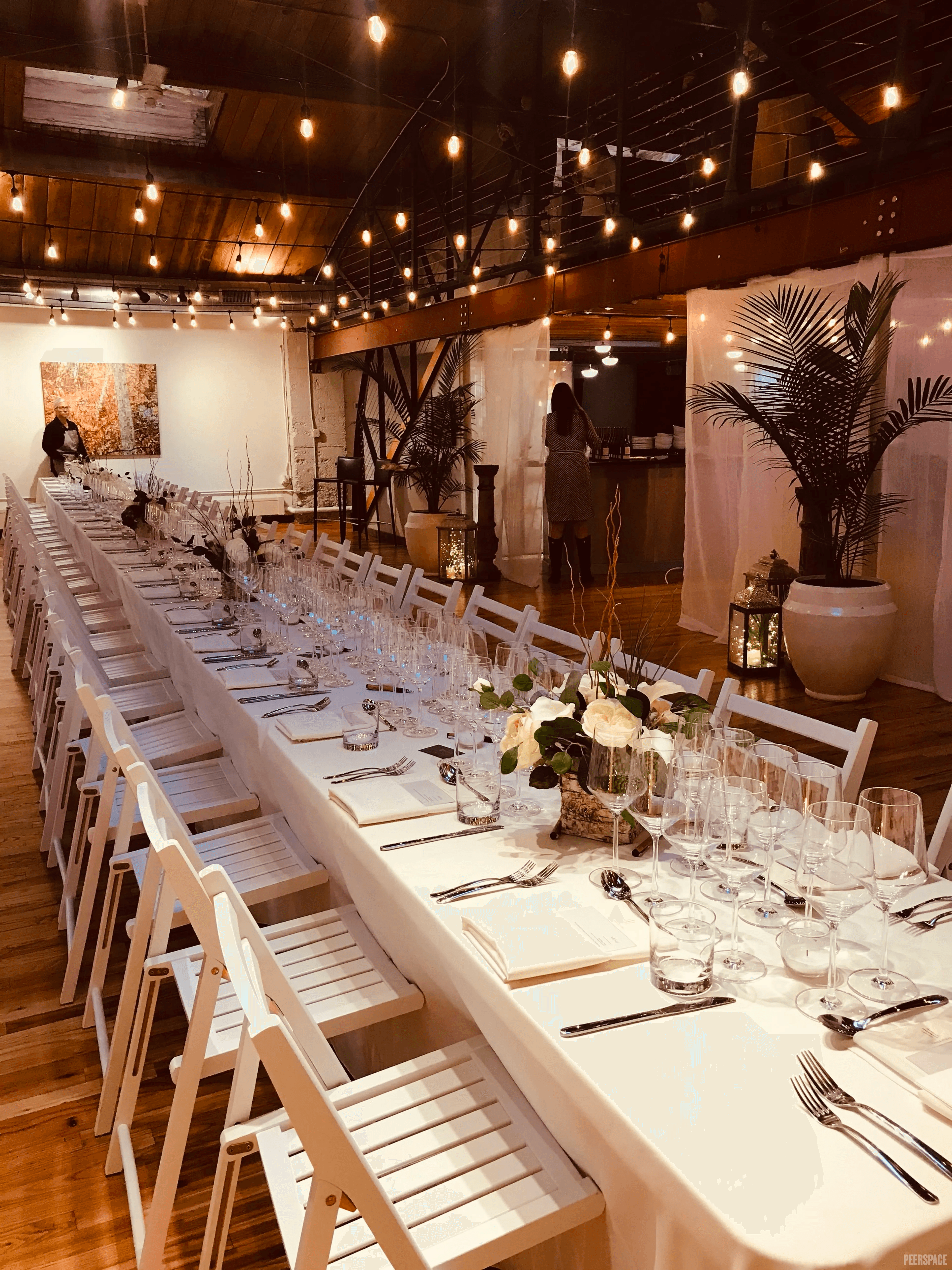 Long-table wedding reception under string lights